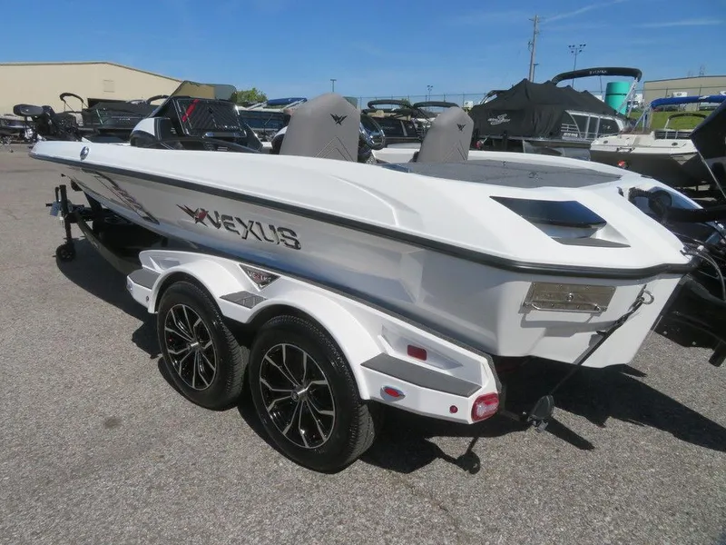Slide: The Image of 2023 Vexus VX20 boat on a trailer in a marina. - 3