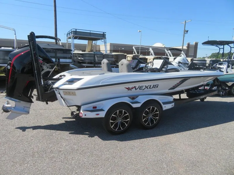 Slide: The Image of 2023 Vexus VX20 boat on a trailer in a parking lot. - 9
