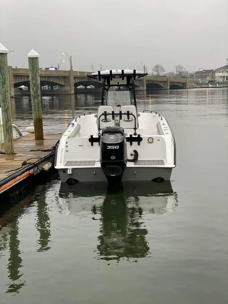 Slide: The Image of 2024 Cape Horn 22 OS boat docked, rear view with 350 HP engine. - 10