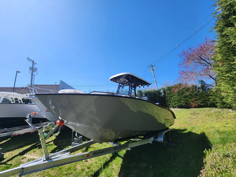 Slide: The Image of 2024 Cape Horn 22 OS boat on trailer under clear blue sky. - 3