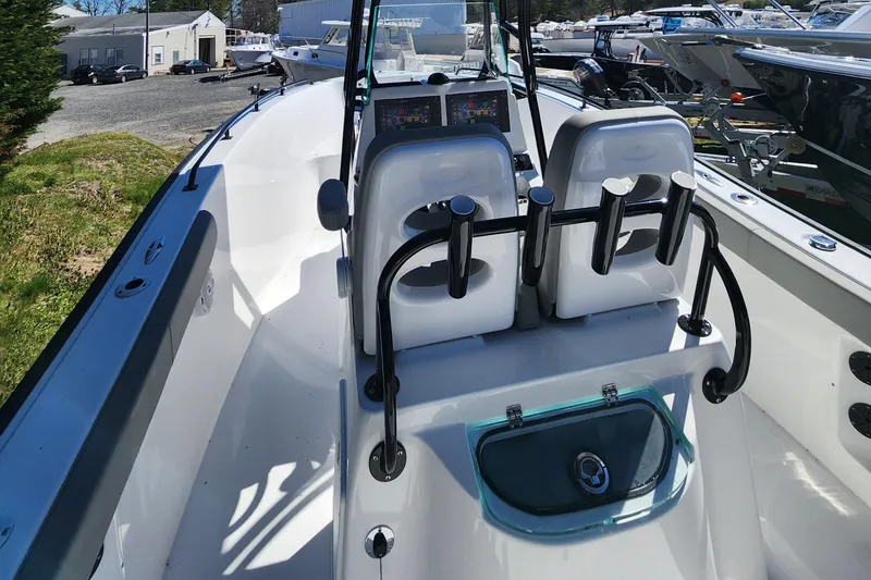 Slide: The Image of 2024 Cape Horn 22 OS boat interior with dual seats and control panel. - 5
