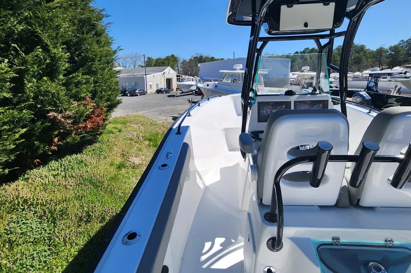 Slide: The Image of 2024 Cape Horn 22 OS boat interior with console and seating. - 6