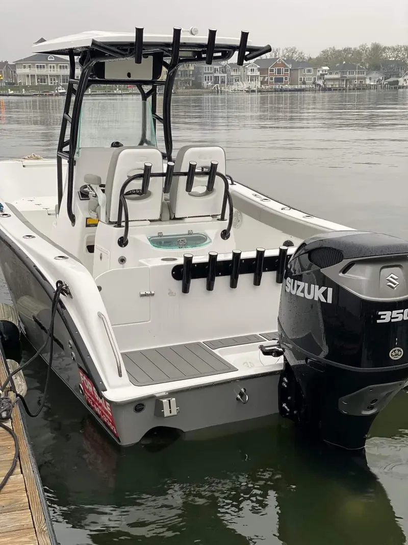 Slide: The Image of 2024 Cape Horn 22 OS boat with Suzuki 350 outboard motor docked. - 8