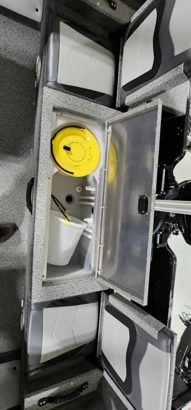 Slide: The Image of 2023 Lowe Fish & Ski 18 boat interior storage compartments. - 2