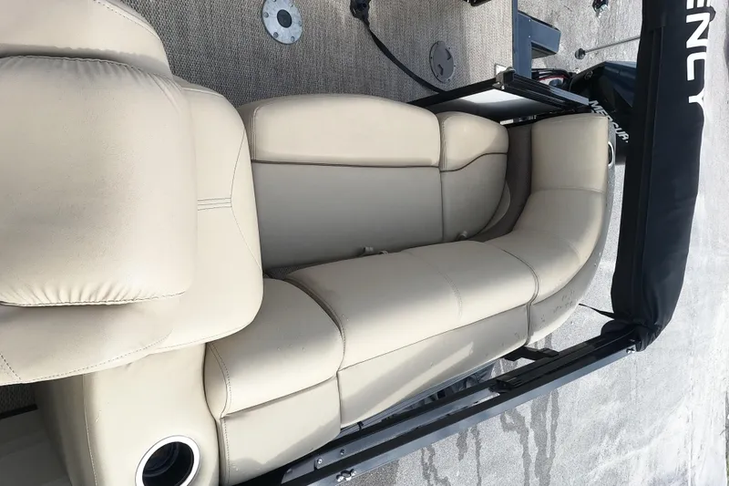 Slide: The Image of 2023 Regency 230 DL3 boat with beige leather seating. - 10