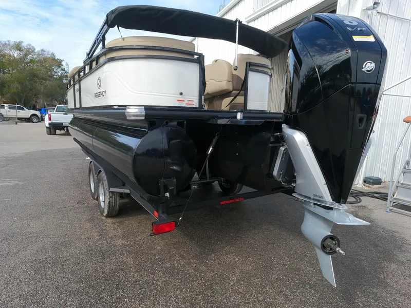 Slide: The Image of 2023 Regency 230 DL3 pontoon boat on trailer, rear view. - 3