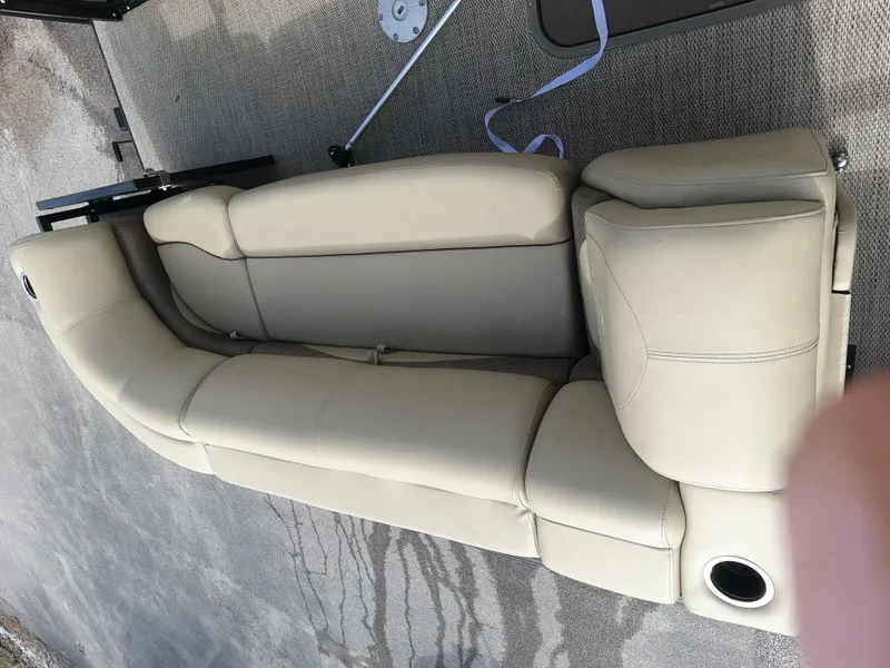 Slide: The Image of 2023 Regency 230 DL3 beige boat seating with cup holder. - 9