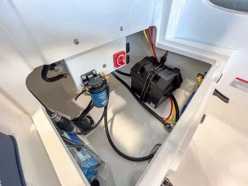 Slide: The Image of 2023 AB Inflatables Nautilus 13 DLX engine compartment with battery and wiring. - 15