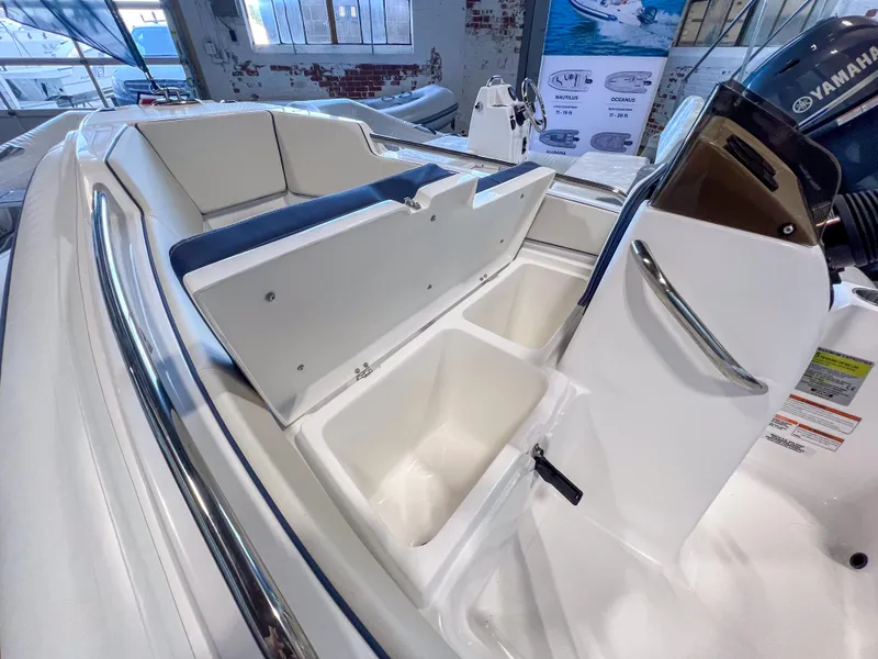 Slide: The Image of 2023 AB Inflatables Nautilus 13 DLX boat interior with storage compartments open. - 16