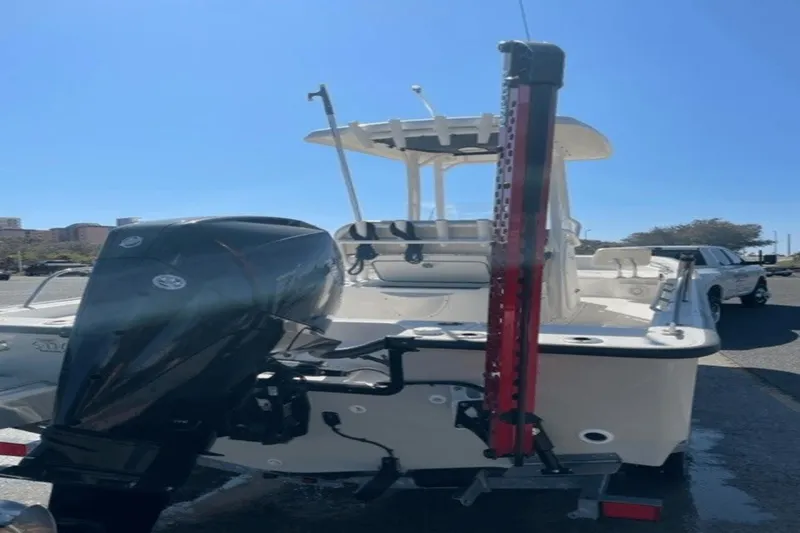 Slide: The Image of 2021 Boston Whaler 210 Montauk boat with outboard motor, parked on trailer. - 14