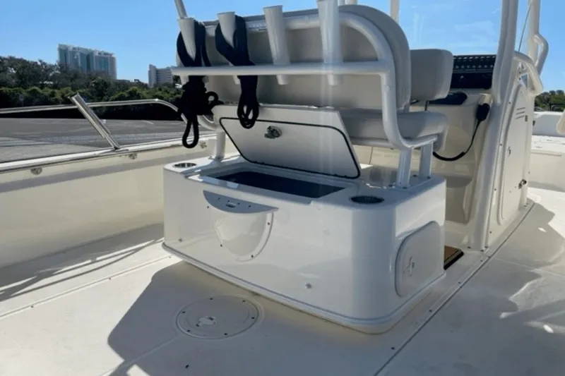 Slide: The Image of 2021 Boston Whaler 210 Montauk boat interior with seating and storage compartment. - 17