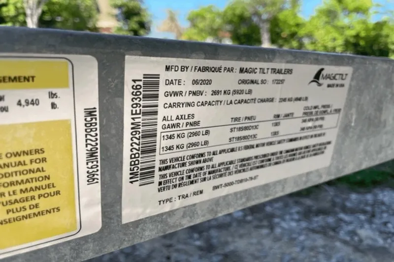 Slide: The Image of Label on Magic Tilt trailer for 2021 Boston Whaler 210 Montauk, showing specifications and capacities. - 22