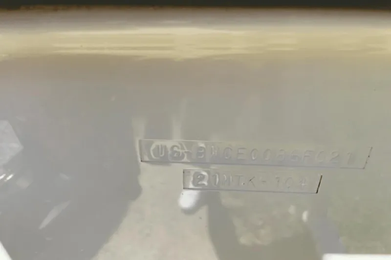 Slide: The Image of 2021 Boston Whaler 210 Montauk hull identification number on boat exterior. - 24