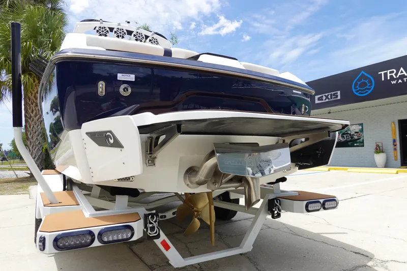 Slide: The Image of 2023 Axis A24 boat rear view, showcasing propeller and swim platform. - 12