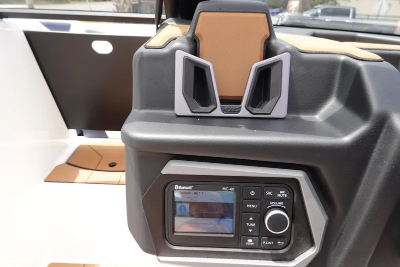 Slide: The Image of 2023 Axis A24 boat dashboard with Bluetooth stereo system. - 23