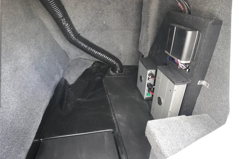 Slide: The Image of 2023 Axis A24 interior compartment with electronic components and wiring. - 29