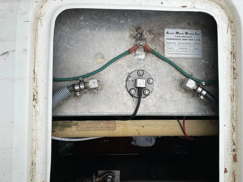 Slide: The Image of Electrical wiring and components inside a 1975 Bertram 28 Flybridge boat. - 16