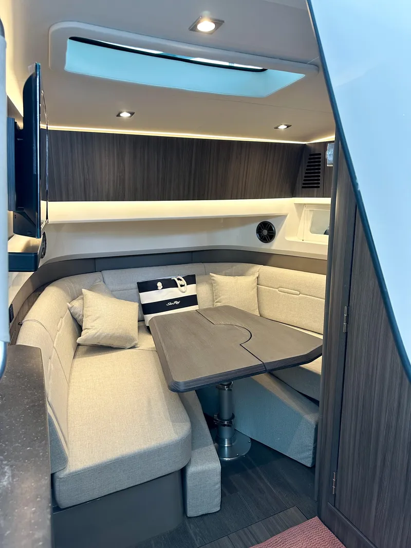 Slide: The Image of Interior of 2023 Sea Ray SLX 400 OB with modern seating and table. - 15