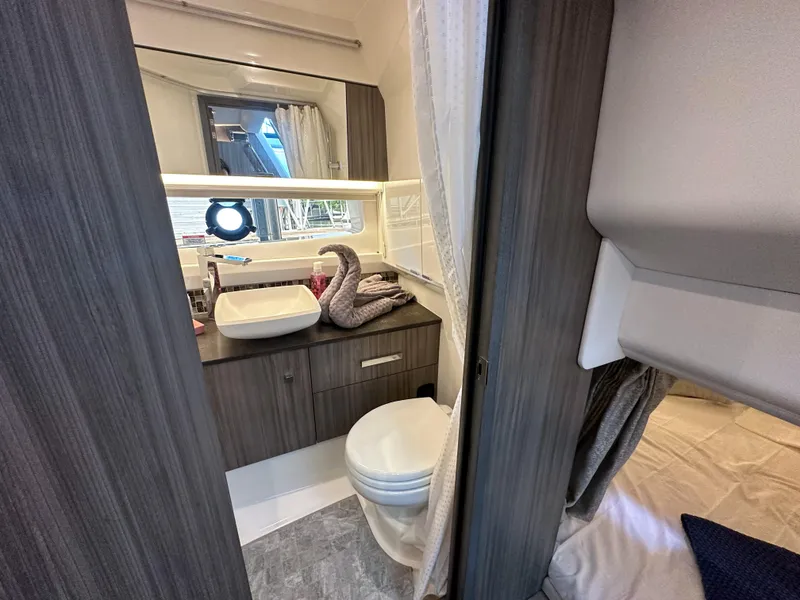 Slide: The Image of Modern bathroom interior of 2023 Sea Ray SLX 400 OB boat with sink and toilet. - 16