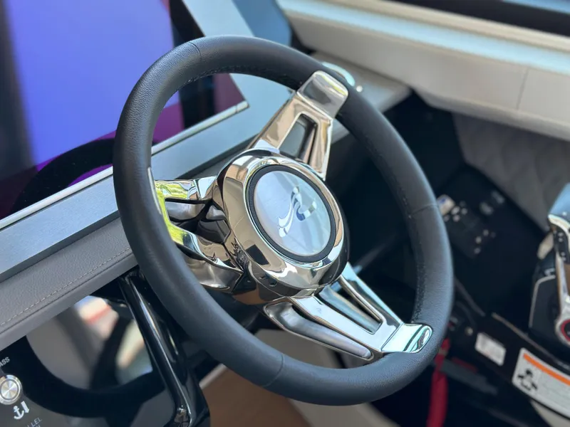 Slide: The Image of Steering wheel of 2023 Sea Ray SLX 400 OB boat. - 31