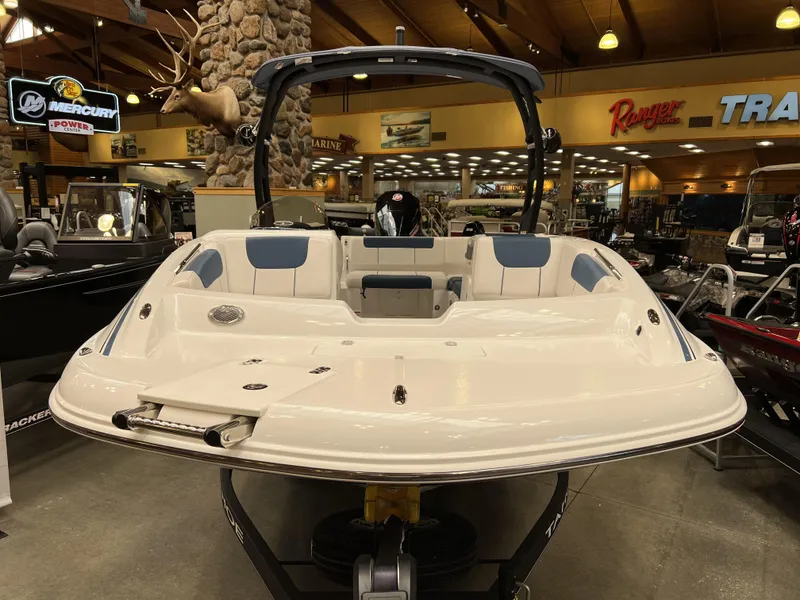 Slide: The Image of 2023 Tahoe 1950 boat on display in showroom. - 1