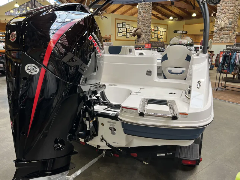 Slide: The Image of 2023 Tahoe 1950 boat with powerful outboard motor in showroom. - 3