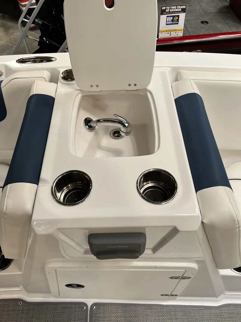 Slide: The Image of 2023 Tahoe 1950 boat interior with sink and cup holders. - 7