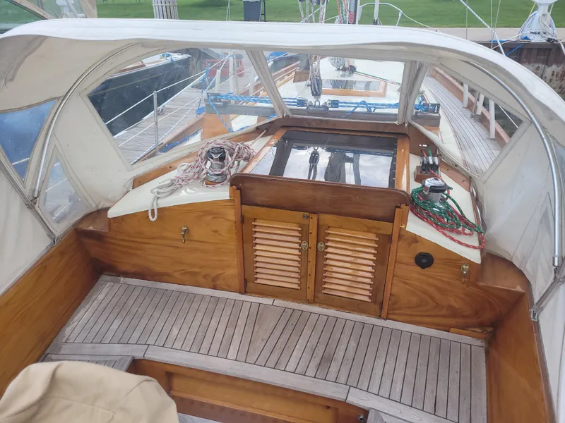 Slide: The Image of Cockpit of 1969 Allied Seabreeze 35 sailboat with wooden finish and ropes. - 10