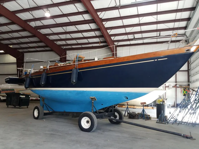 Slide: The Image of 1969 Allied Seabreeze 35 sailboat in a storage facility. - 13