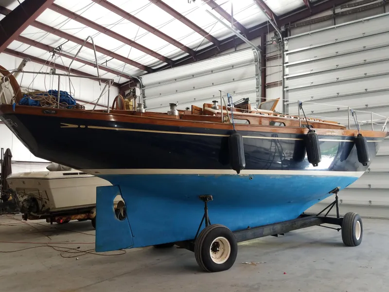 Slide: The Image of 1969 Allied Seabreeze 35 sailboat in indoor storage on a trailer. - 14