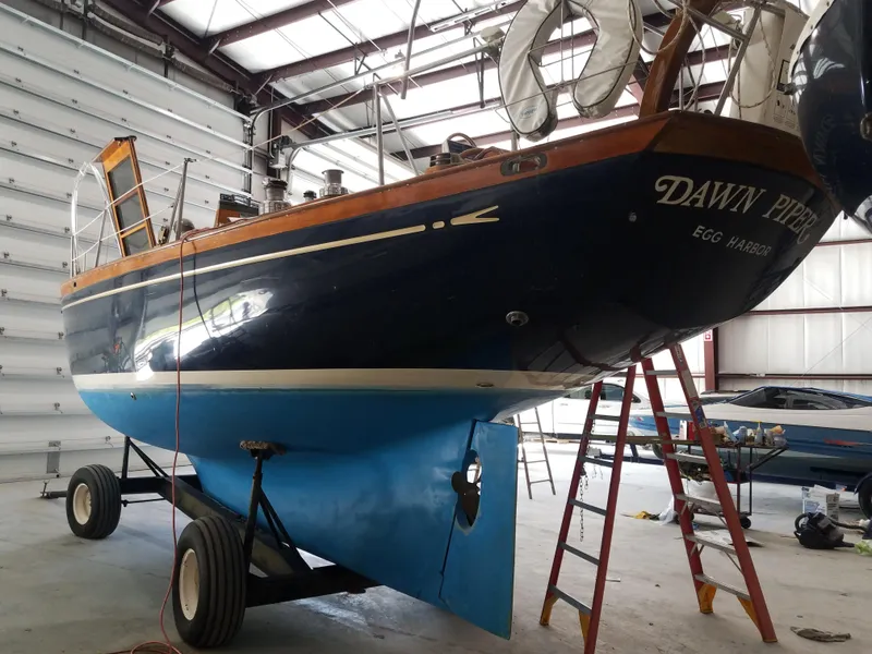 Slide: The Image of 1969 Allied Seabreeze 35 sailboat Dawn Piper in a boatyard for maintenance. - 15