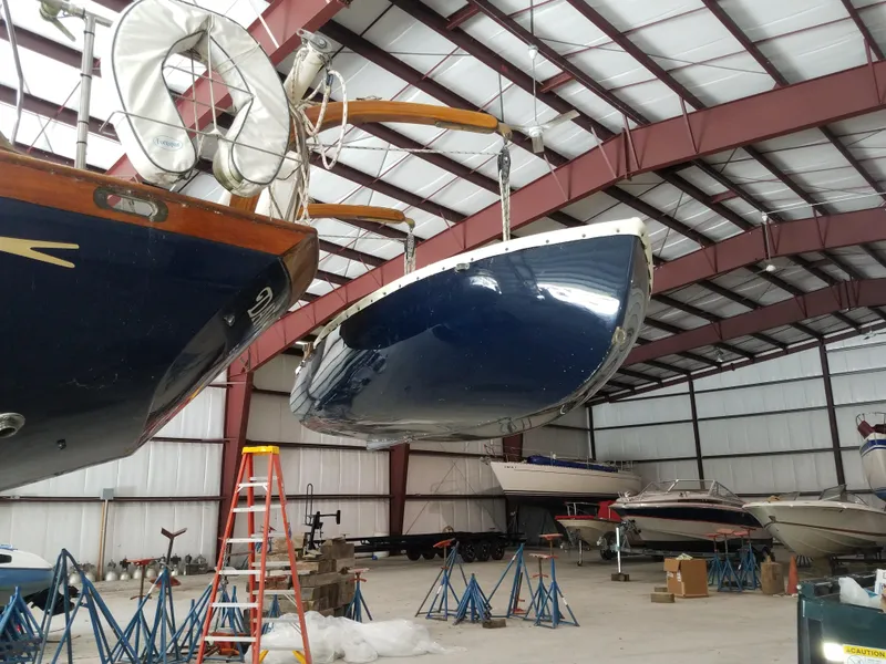 Slide: The Image of 1969 Allied Seabreeze 35 sailboats in indoor storage facility. - 17