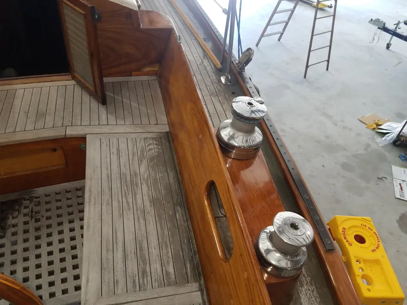 Slide: The Image of 1969 Allied Seabreeze 35 sailboat deck with wooden finish and winches. - 19