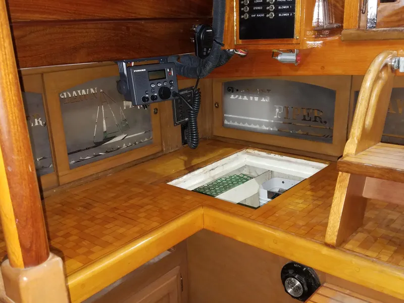 Slide: The Image of Interior of 1969 Allied Seabreeze 35 sailboat with wooden cabinetry and navigation equipment. - 29