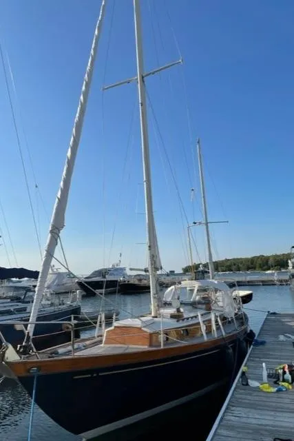 Slide: The Image of 1969 Allied Seabreeze 35 sailboat docked at a marina. - 3