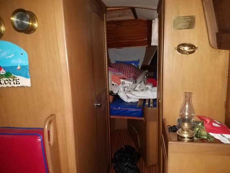 Slide: The Image of Interior of 1969 Allied Seabreeze 35 sailboat with wooden furnishings and nautical decor. - 37