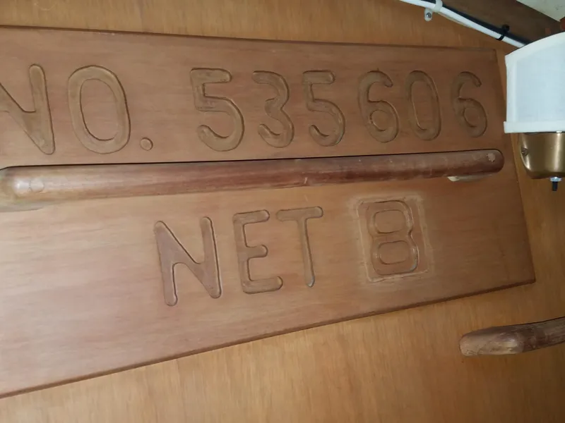 Slide: The Image of Wooden plaque with NO. 535606 NET 8 on a 1969 Allied Seabreeze 35 sailboat. - 42