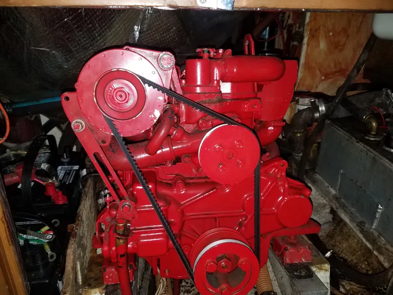 Slide: The Image of Red engine of a 1969 Allied Seabreeze 35 sailboat in the engine compartment. - 43