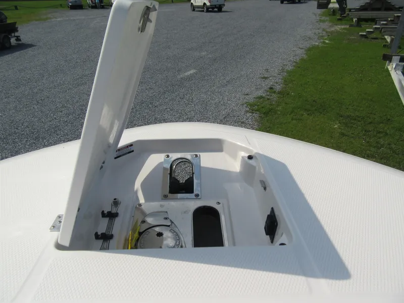 Slide: The Image of Open storage compartment on 2023 Robalo R250 CC boat. - 12
