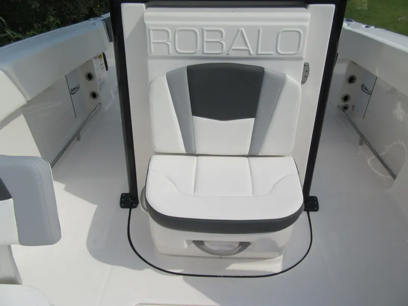 Slide: The Image of 2023 Robalo R250 CC boat seat with white and gray upholstery. - 13