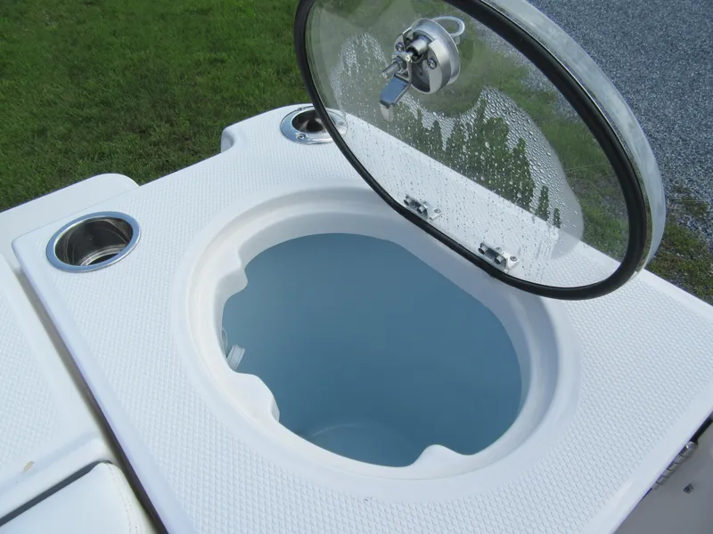 Slide: The Image of Livewell on 2023 Robalo R250 CC boat with open lid. - 17