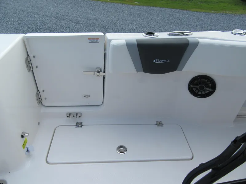 Slide: The Image of 2023 Robalo R250 CC boat deck with storage compartments and speaker. - 18