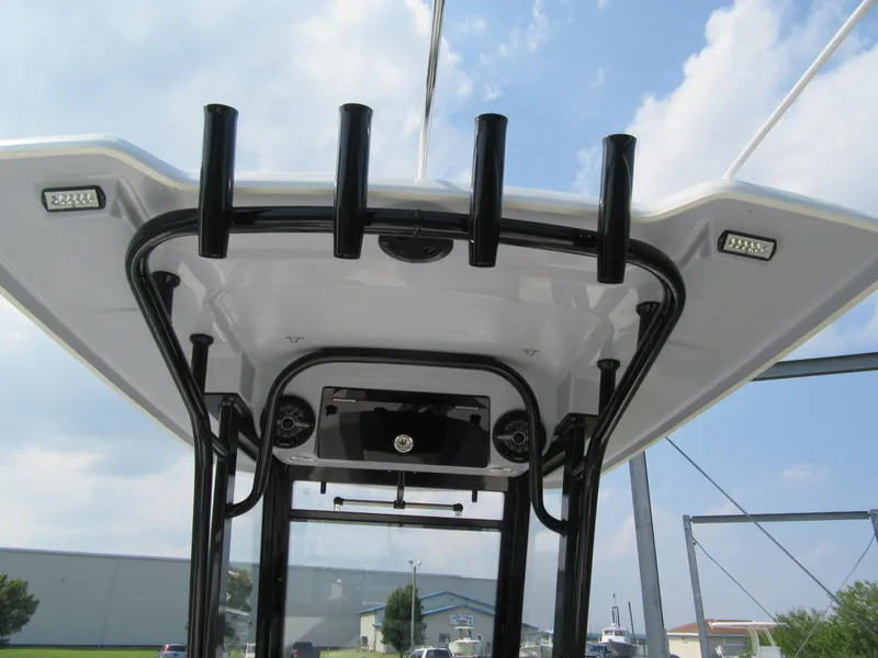 Slide: The Image of 2023 Robalo R250 CC boat T-top with rod holders and LED lights. - 4