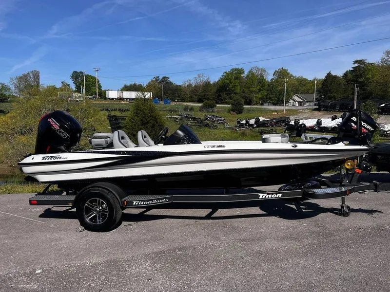 The Image of 2023 Triton 179 TrX fishing boat on trailer, parked outdoors. - 1