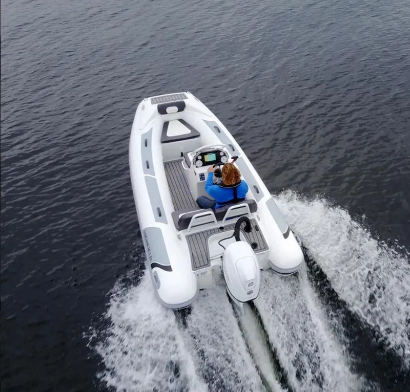 Slide: The Image of 2023 Highfield Sport 390 boat cruising on water, aerial view. - 3