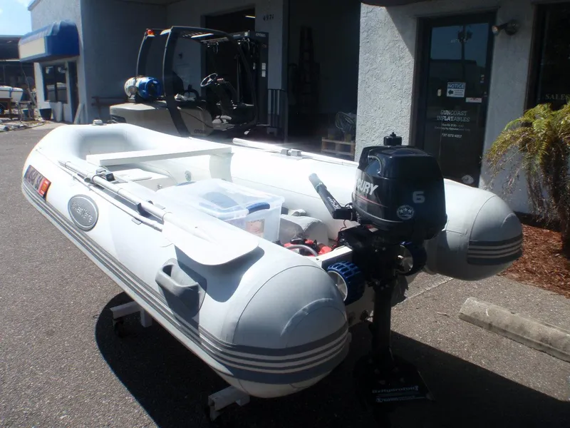 Slide: The Image of 2014 West Marine RIB 310 Double Floor inflatable boat with Mercury 6 outboard motor. - 5