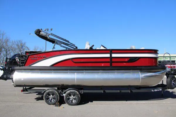 Slide: The Image of 2023 Lowe SF214 Sport Fish pontoon boat on trailer, red and white exterior. - 3