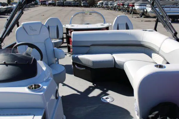 Slide: The Image of 2023 Lowe SF214 Sport Fish boat interior with seating and steering wheel. - 5