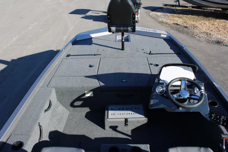 Slide: The Image of 2023 Lowe ST178 fishing boat interior with steering console and seating. - 6