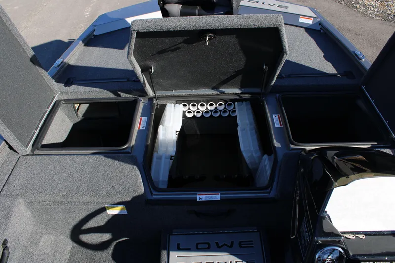 Slide: The Image of 2023 Lowe ST178 boat with open storage compartments and rod holders. - 9